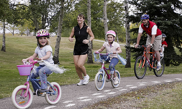 people jogging and riding bikes