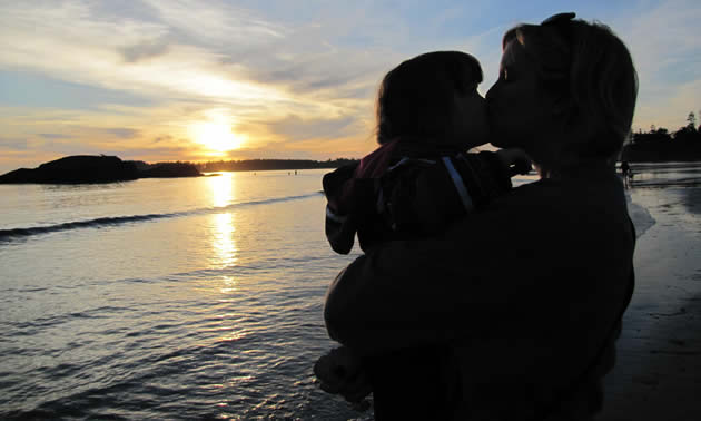 Reva's all-time favourite photo. Her daughter and granddaughter having a loving moment on the beach at Crystal cove.