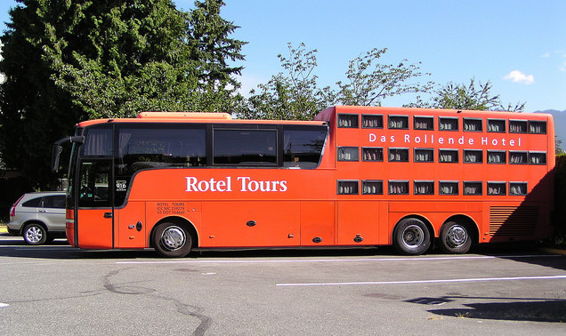 A red Das Rollende Hotel parked as an RV