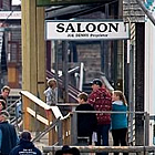 heritage town with horse drawn buggies and people in period costume