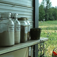 Brown Eggs and Lamb Country Store, Lacombe, AB displays locally milled flour on an outdoor shelf. 