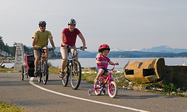 people riding their bikes on the coast of BC