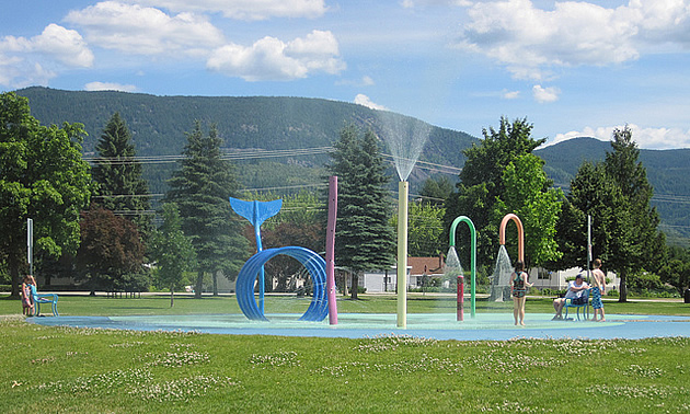 people playing at a spray park