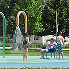 people playing at a spray park