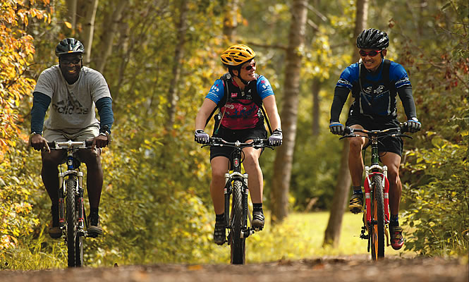 three people riding bikes