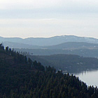 aerial photo with mountains surrounding a lake