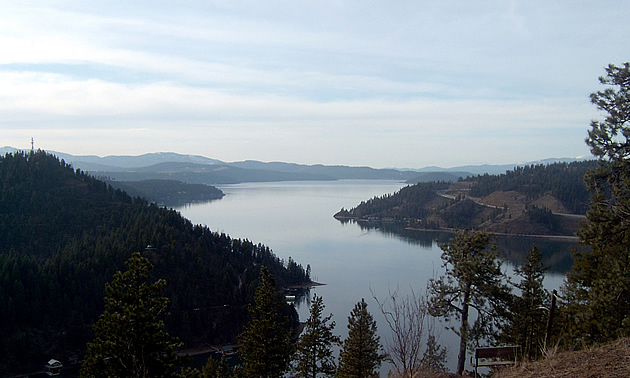 aerial photo with mountains surrounding a lake