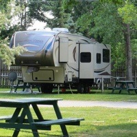 A 5th wheel parked at the Daisy May Campground and RV Resort in For Macleod, AB