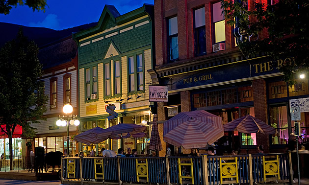 sidewalk cafes with tables and umbrellas