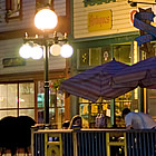 sidewalk cafes with tables and umbrellas