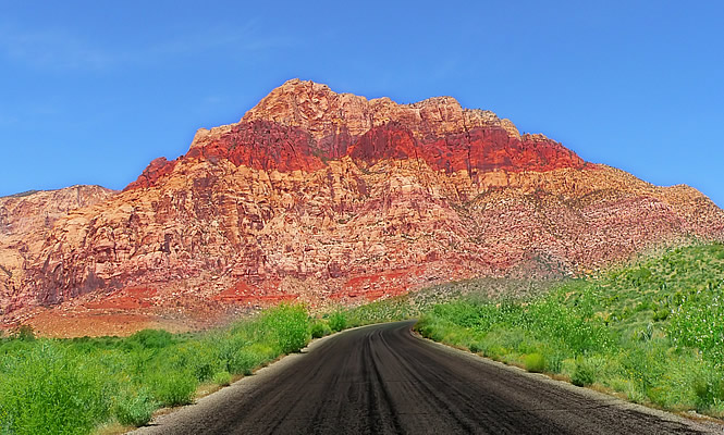 Road leading to a red rock formation