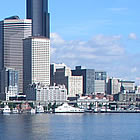 ferry crossing water to a city scape