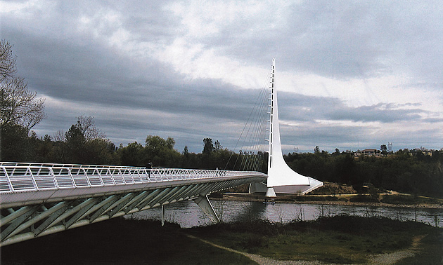 bridge over water on a cloudy day