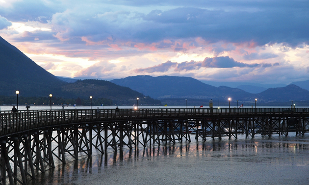 wharf with people walking along it, in Salmon Arm, BC