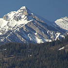 sign entering town that says Sparwood, mountains in background