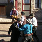 people staging a gun fight