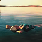 Lady floating in Lake Manitou