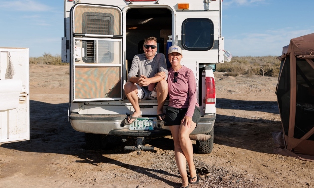 Michele and Mark beside one of their RV units