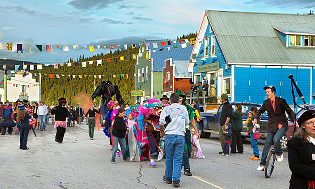 people on a main street celebrating a festival