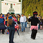 people on a main street celebrating a festival