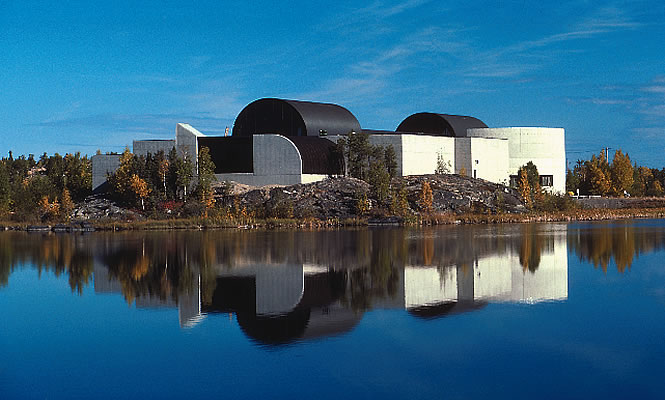 exterior of a building and reflection in the water nearby